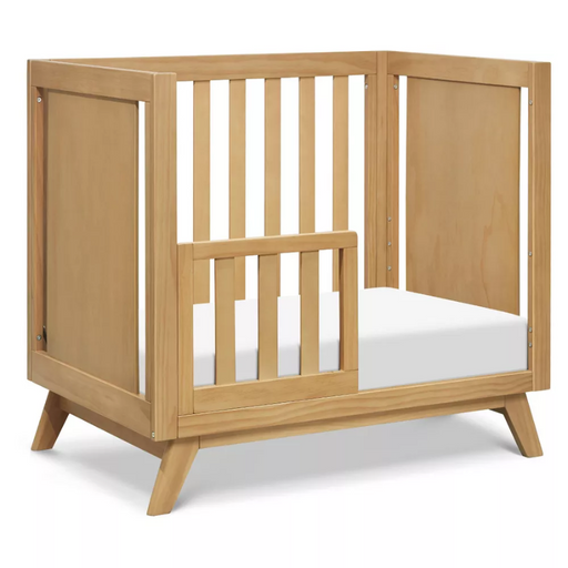 Otto 3-in-1 Convertible Mini Crib - Honey by DaVinci Baby at $429! Shop now at Nestled by Snuggle Bugz for Cribs.