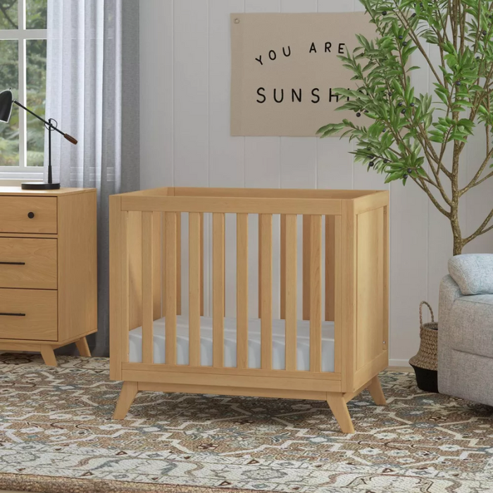 Otto 3-in-1 Convertible Mini Crib - Honey by DaVinci Baby at $429! Shop now at Nestled by Snuggle Bugz for Cribs.