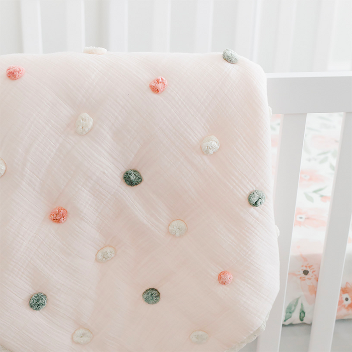 Pom Pom Quilted Baby Blanket by Crane at $119.99! Shop now at Nestled by Snuggle Bugz for Nursery & Décor.