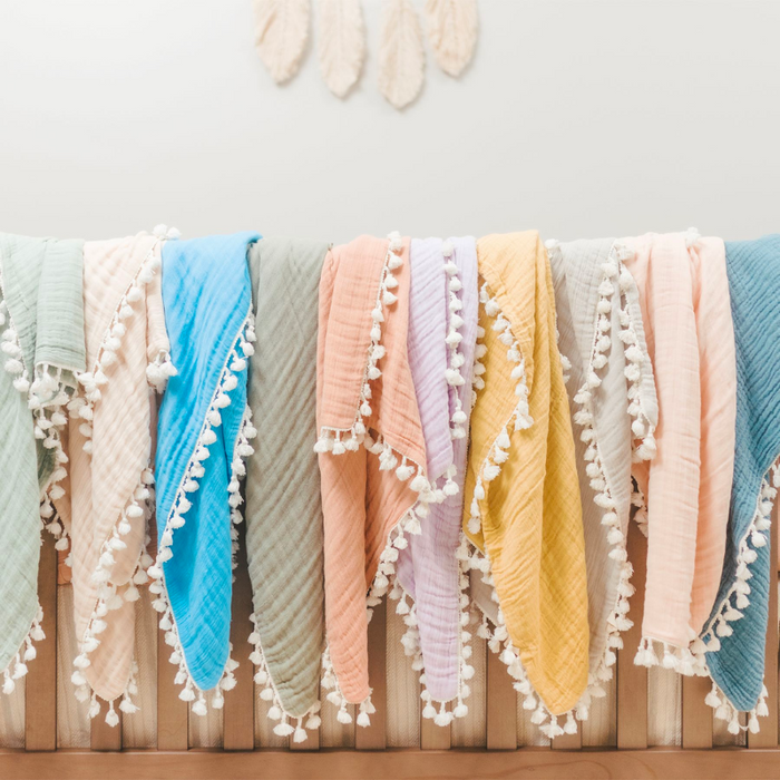 Tassel Muslin Blanket by Crane at $57.99! Shop now at Nestled by Snuggle Bugz for Nursery & Décor.